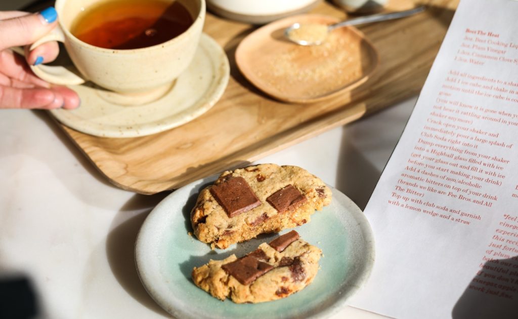 Tea and chocolate chip cookie at Little Saint Restaurant.