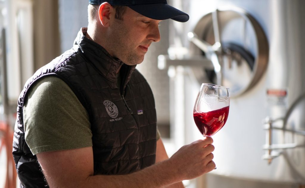 Priest Ranch Wines Winemaker Cody Hurd tasting wine.