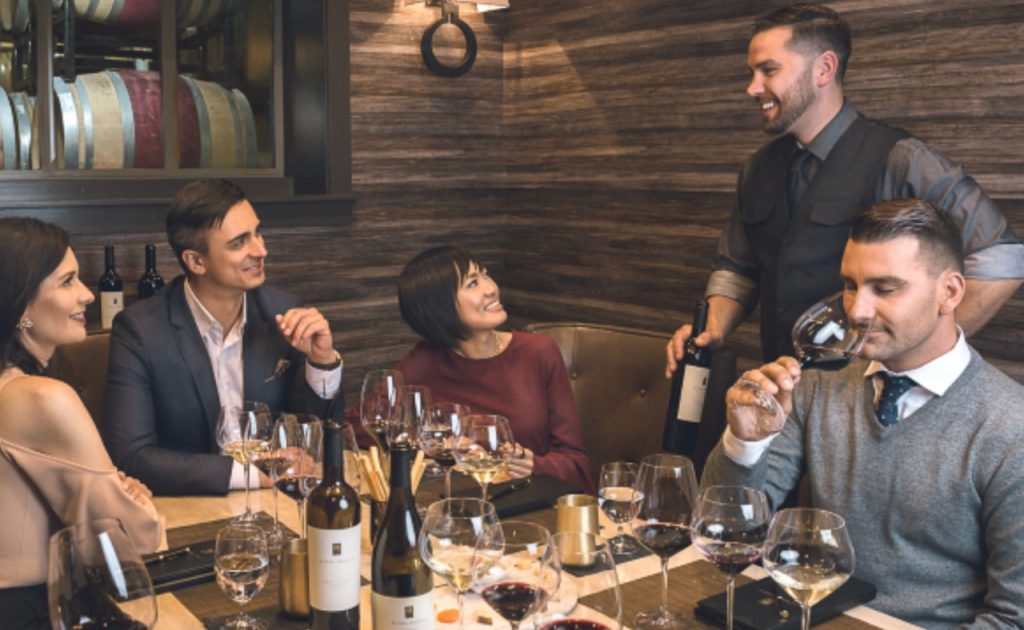 Alpha Omega Winery guests sipping wine during private tasting.