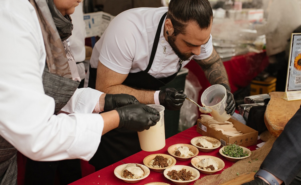 Chef preparing food at Hall Winery's Cabernet Cookoff event.