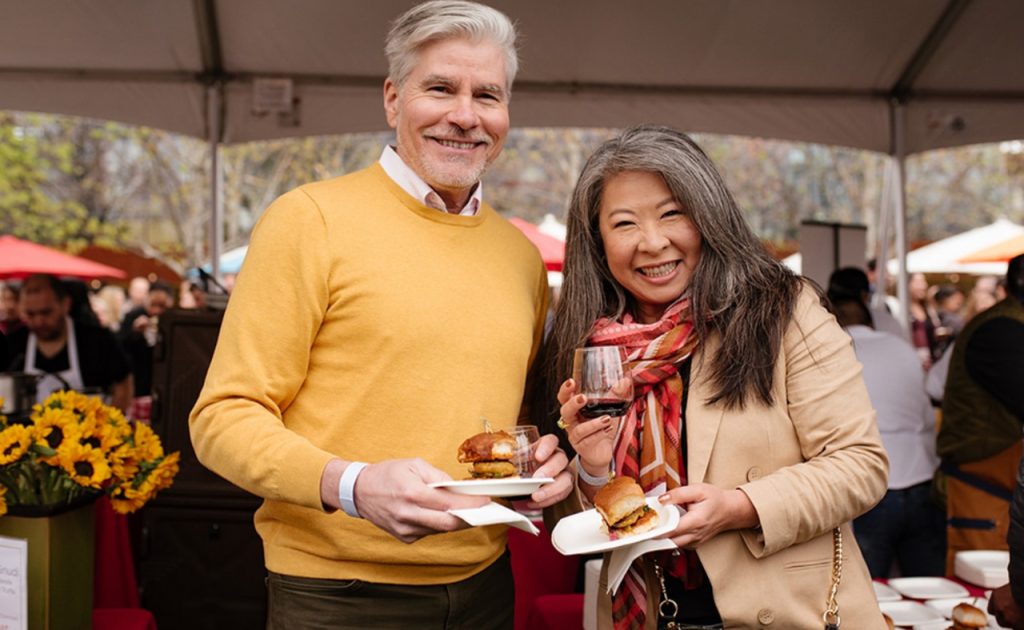 Guests enjoying food and wine at Hall Napa Valley Cabernet Cookoff.