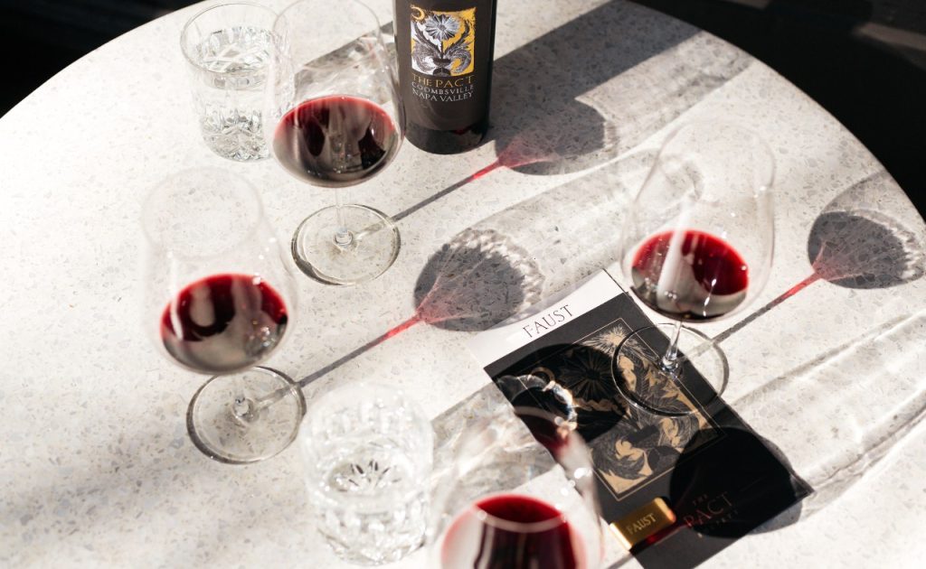Faust red wine on table. 