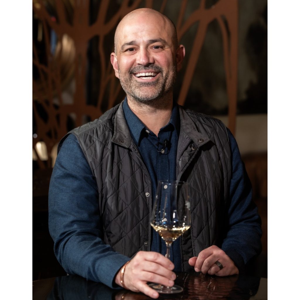 Serial Wines Executive Winemaker, Jeff Kandarian holding a glass of wine.