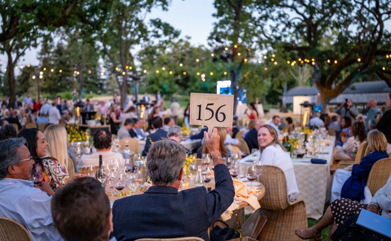 Bidding during LIVE auction and dinner at Auction Napa Valley.