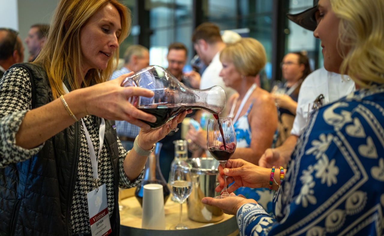 Pouring wine at Auction Napa Valley.