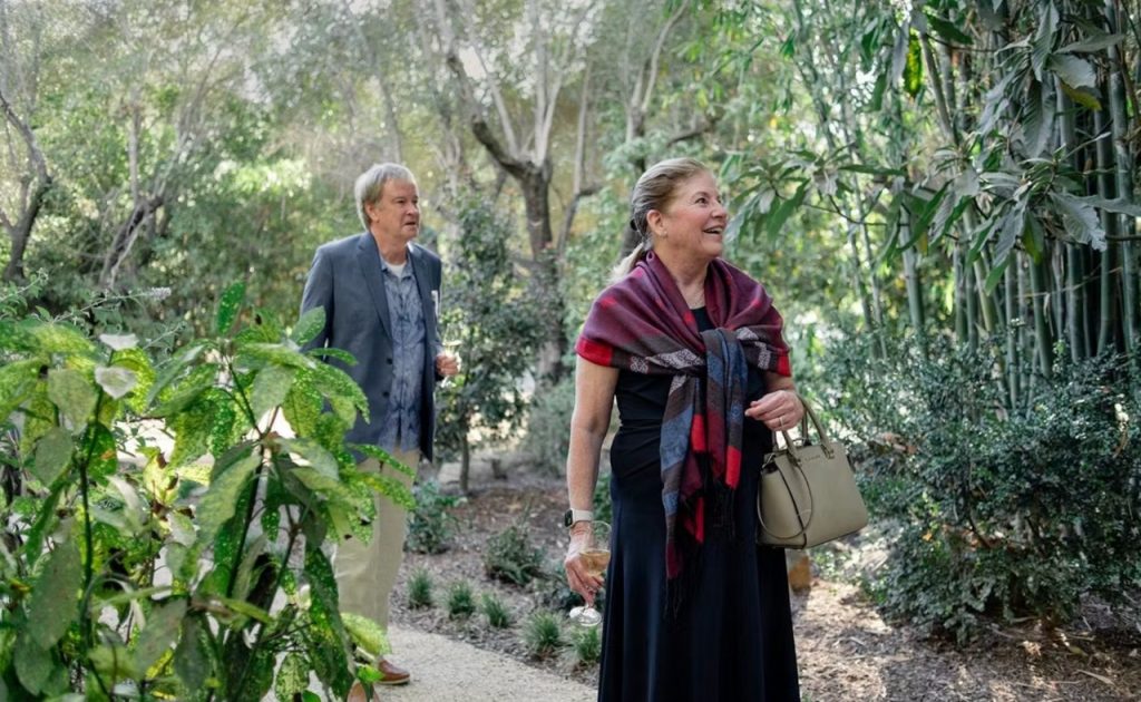 Guests strolling through the garden during Summer Soirée at Spring Mountain Vineyard.