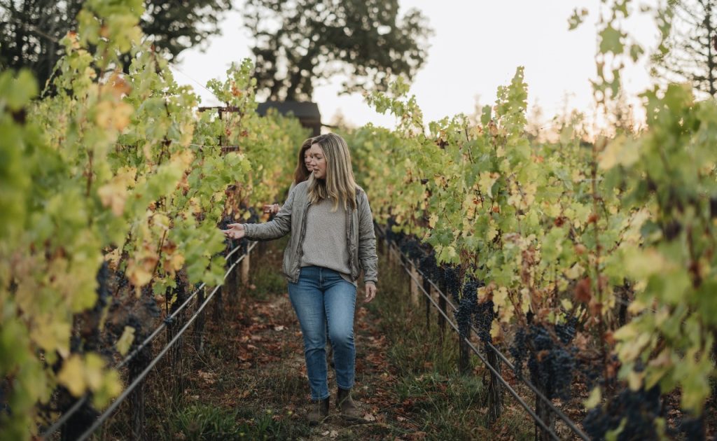 Brittany Sherwood, Heitz Cellar Director of Winemaking waling in vineyard.