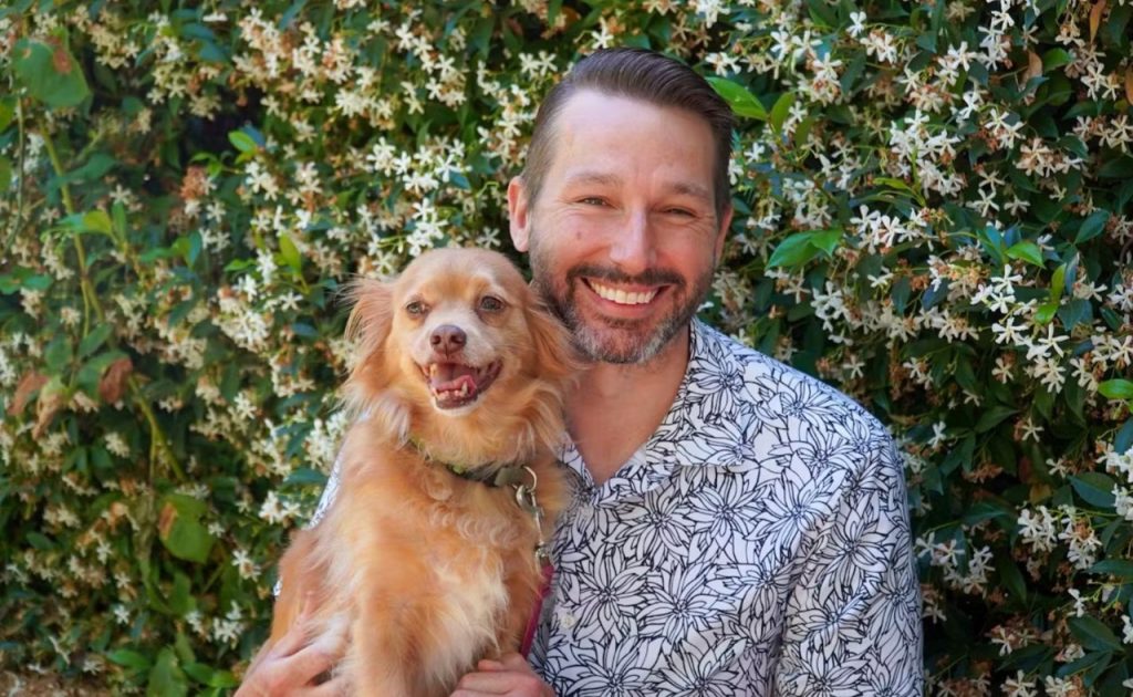 Man holding dog at Matanzas Creek Winery.