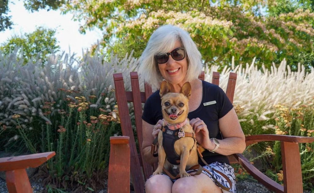 Woman holding dog at Matanzas Creek Winery.