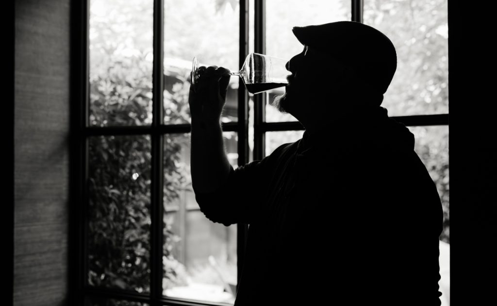 Winemaker Matt Taylor tasting wine.