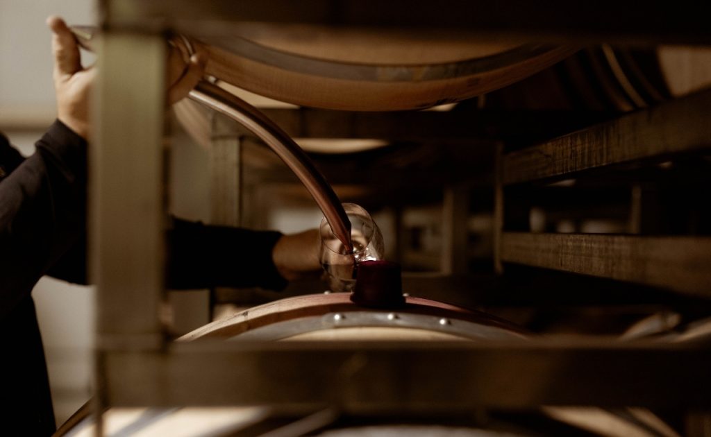 Winemaker Matt Taylor sampling wine from the barrel at Ink Grade Estate.