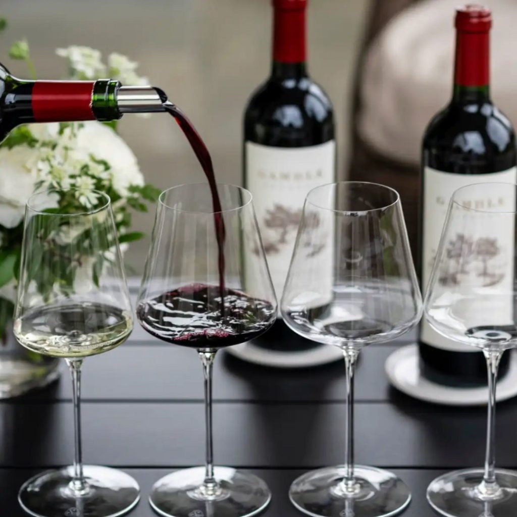 Gamble Estates wine being poured in a glass.