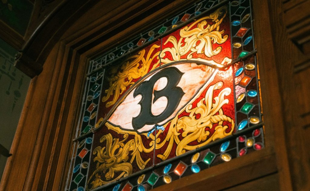 Stained glass window with letter B at Beringer Vineyards.